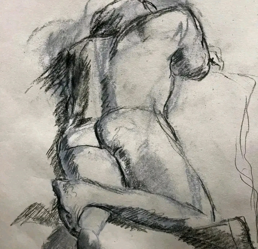 Life drawing picture of a man lying on his front