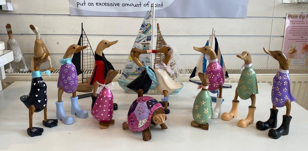 large selection of painted wooden ducks at arty boat exmouth
