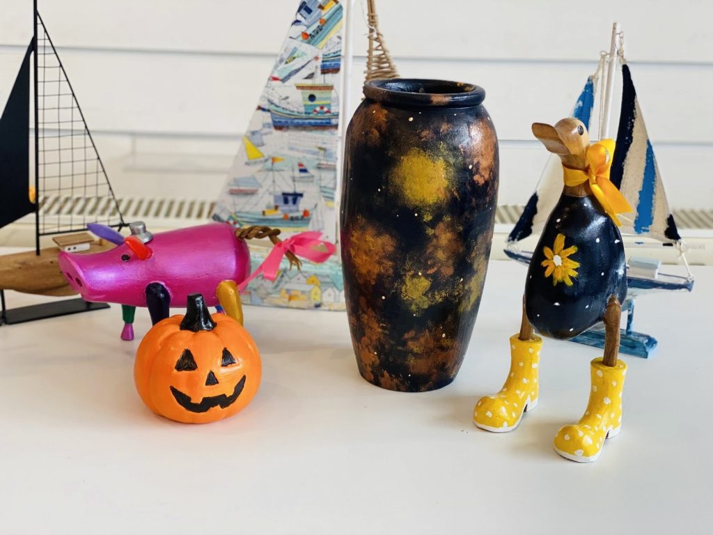 amazing painted creations at arty boat, pink pig, orange pumpkin, black and orange vase and a black and yellow duck