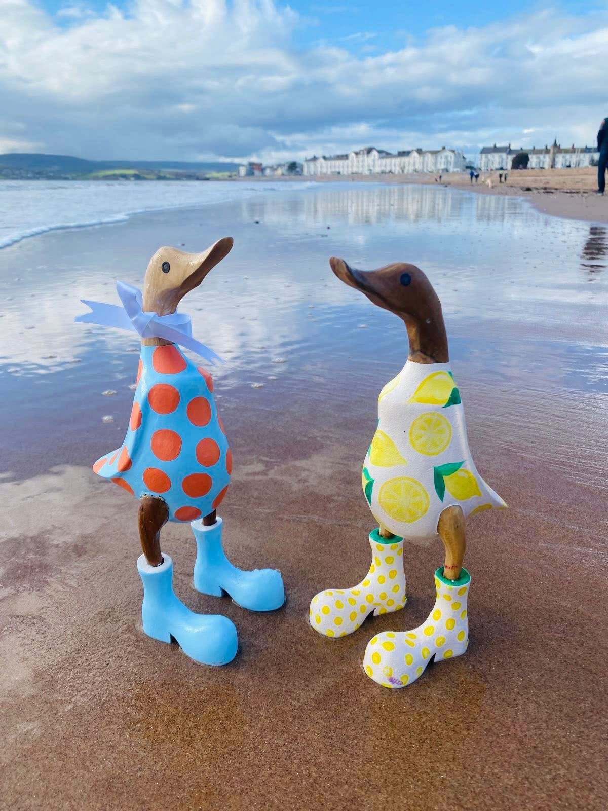 Things to do near Devon Cliffs – wooden duck painting experience at Arty Boat Exmouth