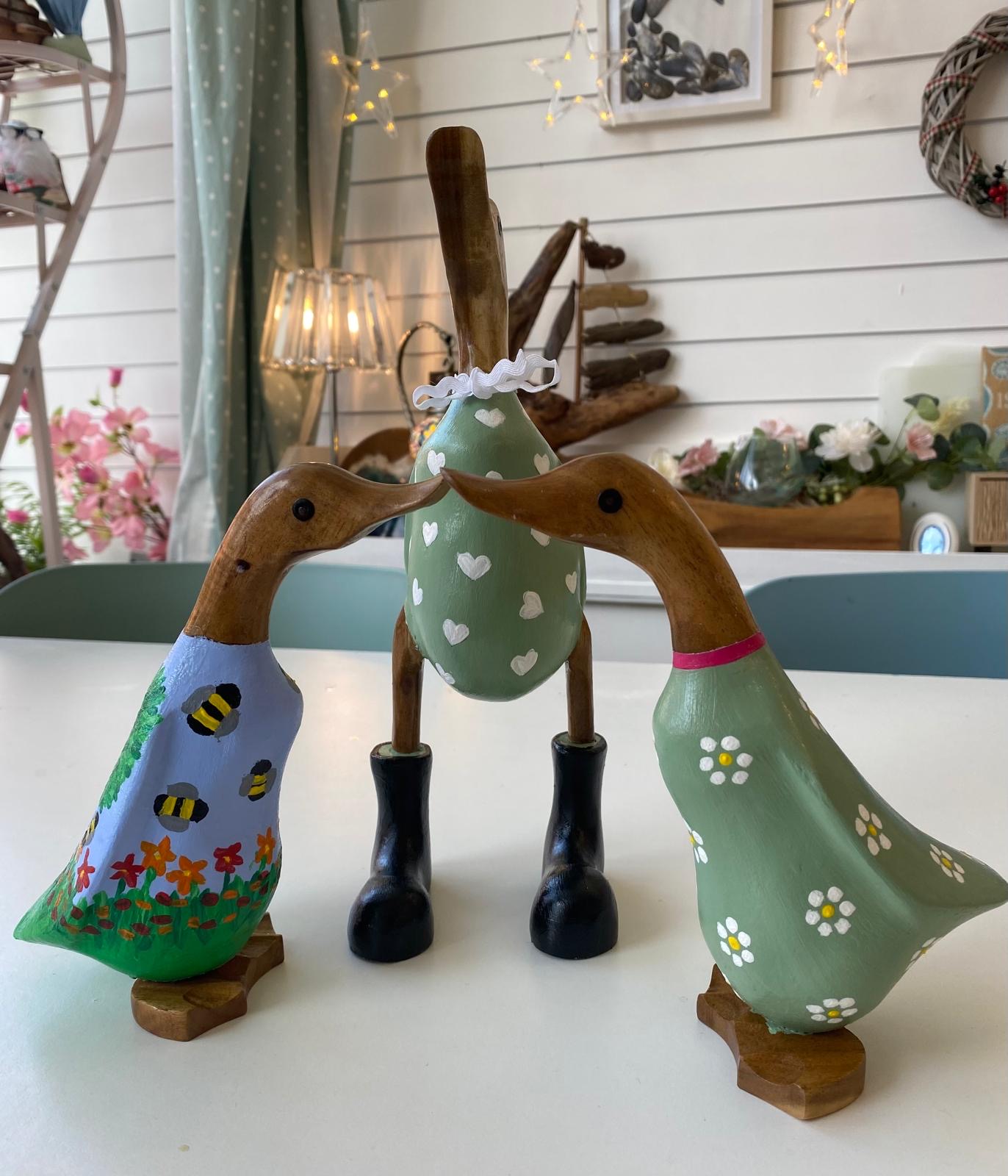 Painted wooden ducks at Arty Boat in Exmouth