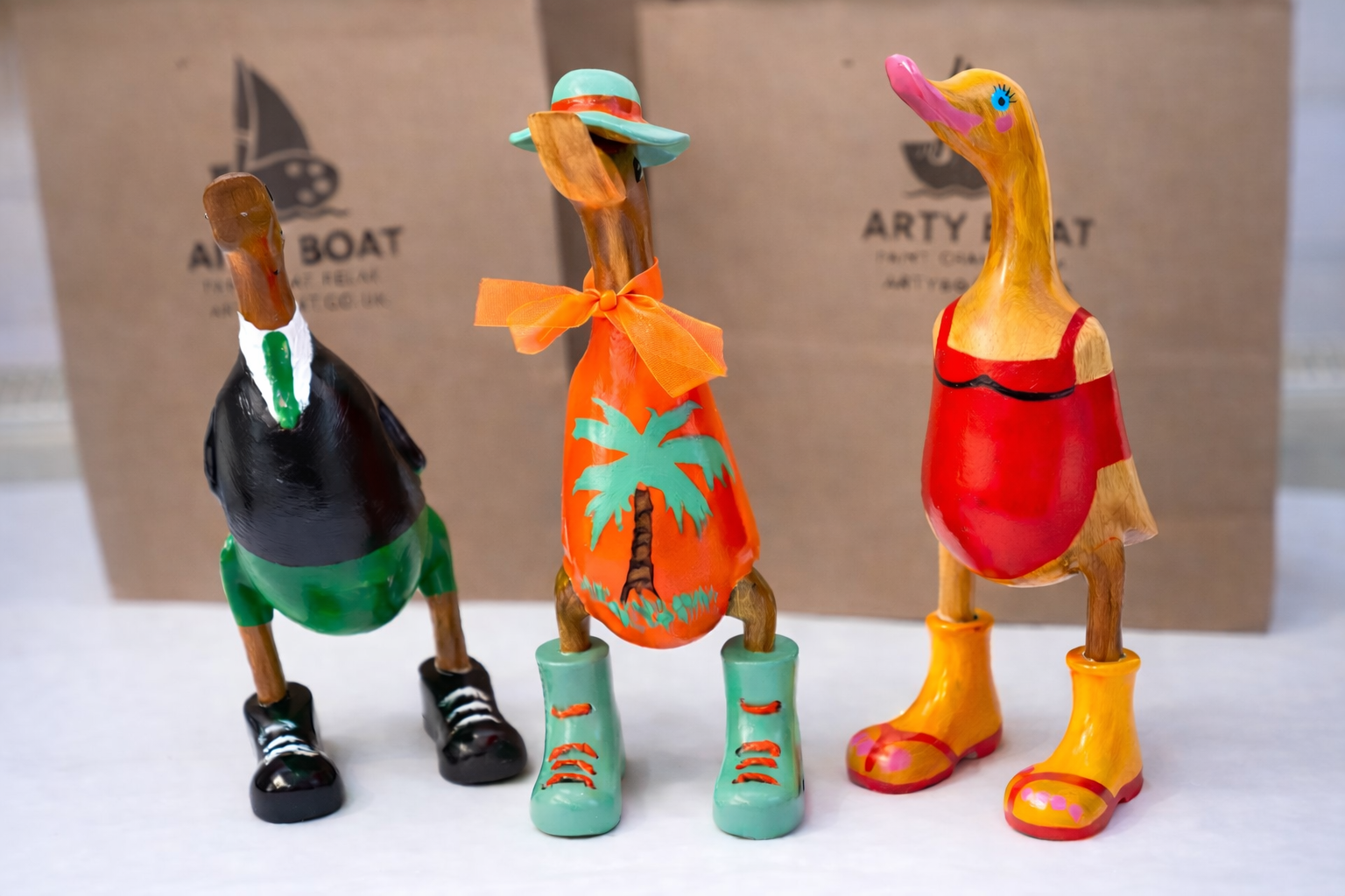 Three colourful character ducks painted at Arty Boat