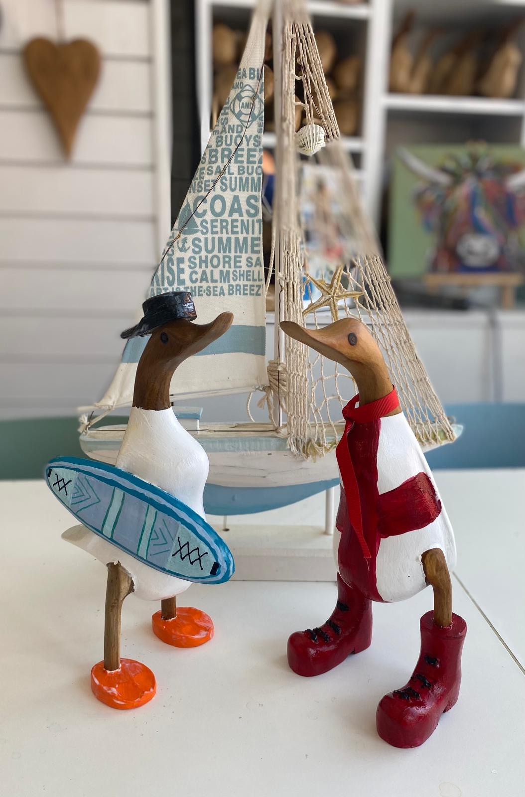 Colourful coastal themed wooden ducks painted at Arty Boat Exmouth Devon