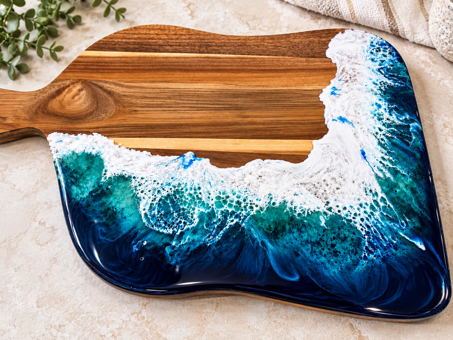 Ocean-inspired resin seascape board made at an Arty Boat resin workshop in Exmouth